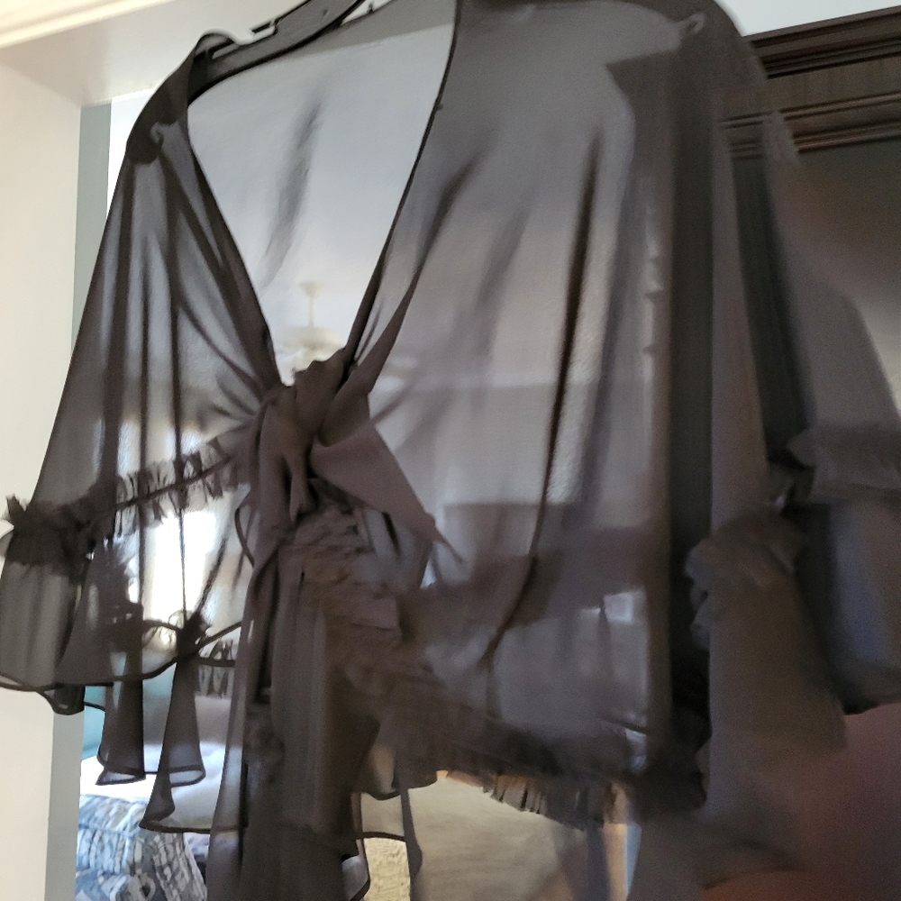 Black cape ties in front